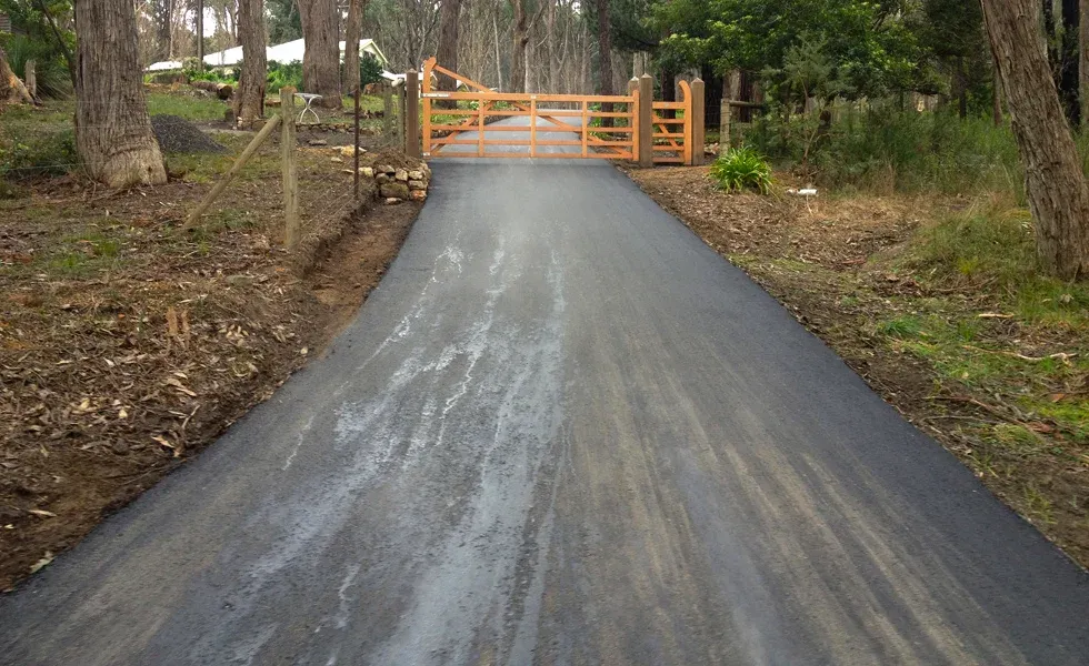 Long Driveway With New Asphalt Laid